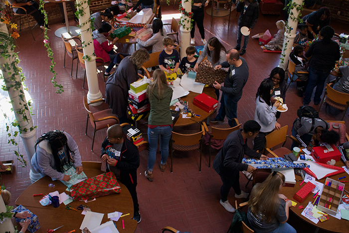 Wrapping gift boxes for children in the Newton County foster care program